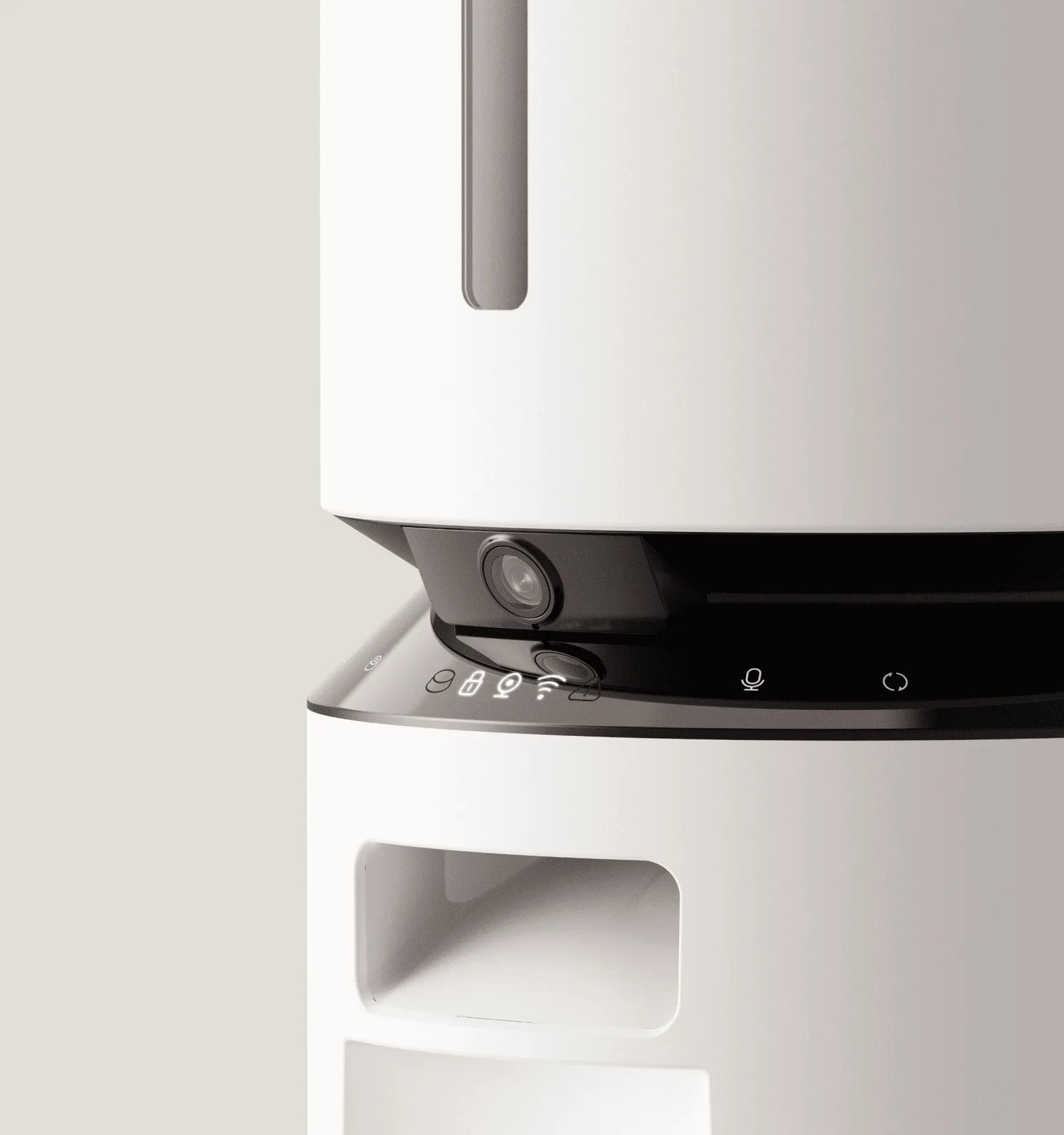 Close-up of the dispensing chute and control panel on a white pet feeder